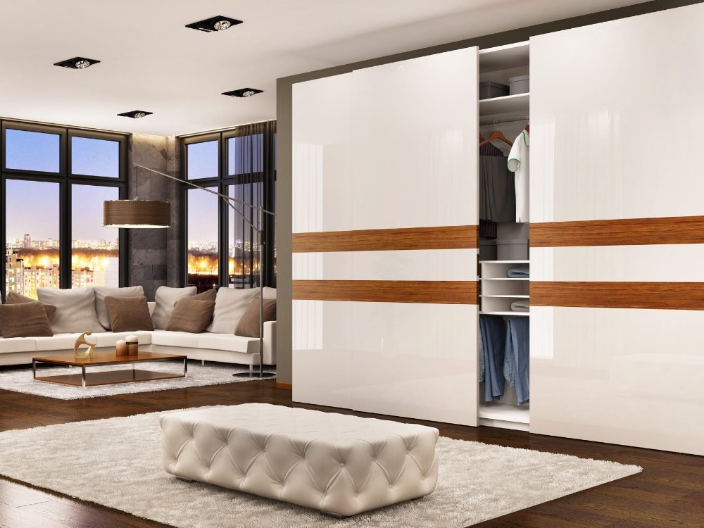 Sliding wardrobe with glossy shutters and wooden inlay bands
